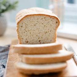 Gluten-free white sandwich bread on cutting board