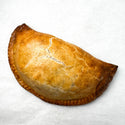 Gluten-free cheesesteak hand pie on white