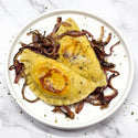 Two pierogis with onions