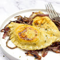 Two pierogis with onions